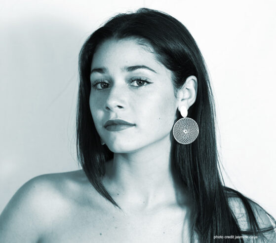 AZURE, singer and songwriter, artist headshot in blue tint.